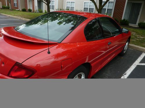 One owner excellent condition red pontiac sunfire,