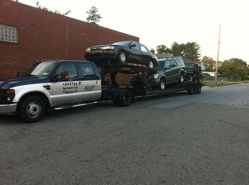 Iit's a blue-silver color..4 doors..5th wheel..3 car hauler.. appalachi trailer