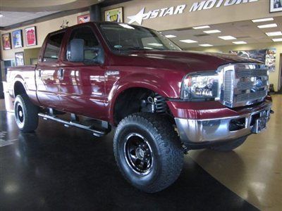 06  f250 crew cab lariat diesel 4x4 dark red tan leather lifted