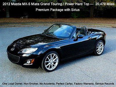 ---   grand touring / power hard top / automatic /   $32,235 msrp