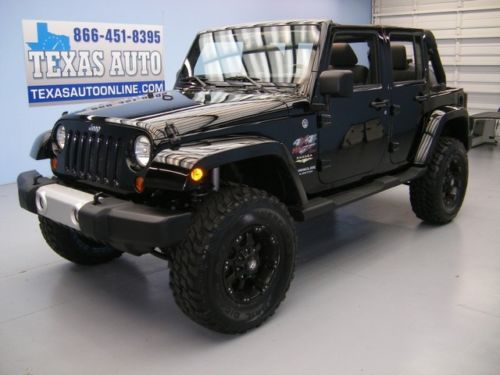 We finance! 2011 jeep wrangler unlimited sahara 4x4 lift nav hard top texas auto