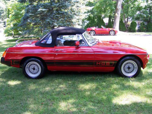 Red convertible, with manual transmission, looks like new.