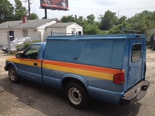 Chevy s-10 pick up truck. blue with locking cap and door. good condition