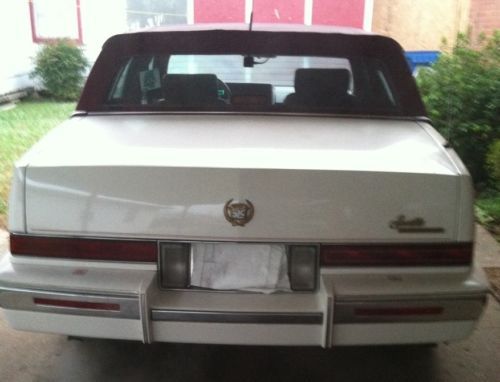 4 dr, white w/burgundy top and interior, 1 owner car, 105k miles, ac/heat works