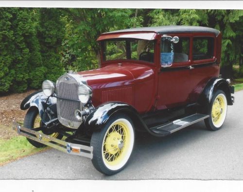 Beautifully restored 1929 ford tudor    burgundy with yellow spoke wheels !