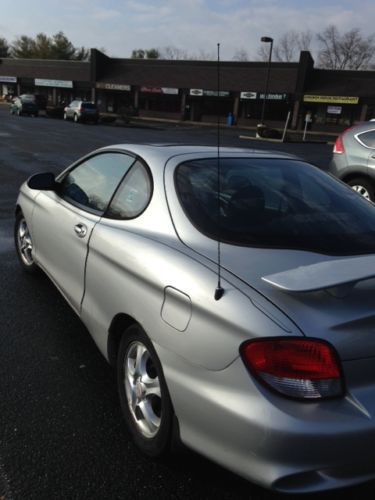 Hyundai  model: tiburon color; gray..running excellent, never crashed!