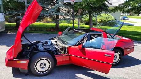 1985 red corvette 14,000 miles 2 owners garage kept runs, drives, looks near new