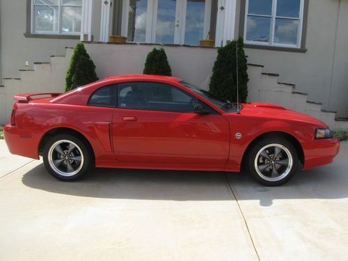 04 mustang gt 5100 original miles 5spd red mint cond.