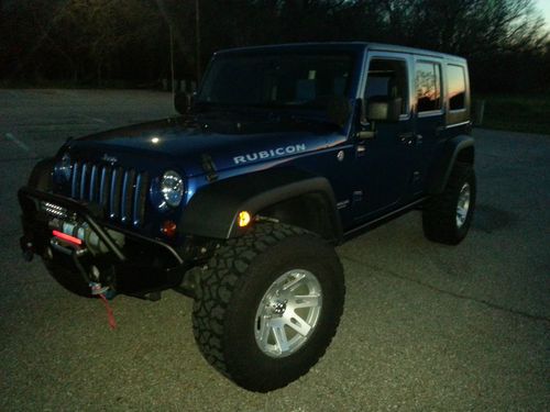 2010 jeep wangler unlimited rubicon with 2 1/2 inch ome lift, 35's and winch