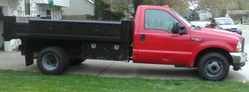 2004 ford f350 red automatic super duty  w/ 11 ft.dump bed;new parts;runs smooth