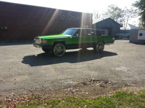 Candy green cadillac on 26 inch dub floaters with 6 memphis 10s