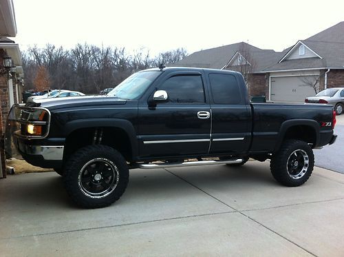 06 chevy silverado 1500 z71, ext cab, 4x4, 6" super lift 20" 35.12.50 r20