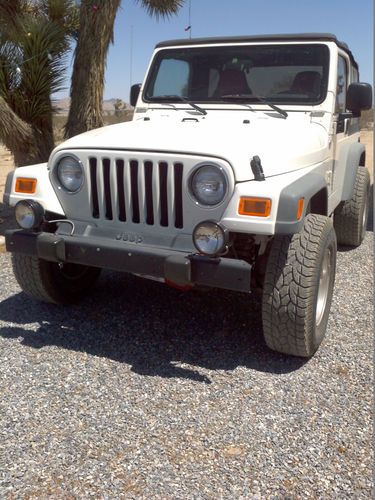 2005 white jeep wrangler, runs perfect, 94,500 miles.