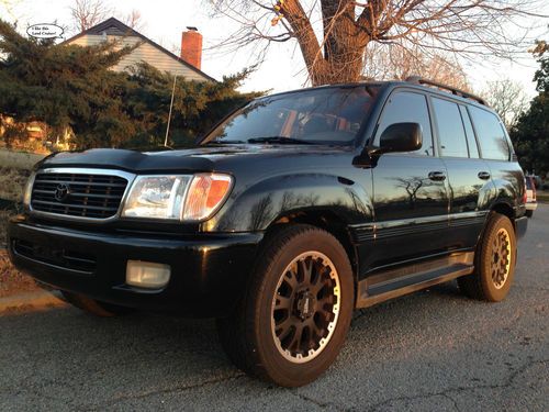 1999 toyota land cruiser black/tan leather 18" wheels low miles very nice shape