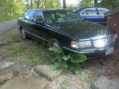 1999 cadilac deville 4 door green 140,000 miles