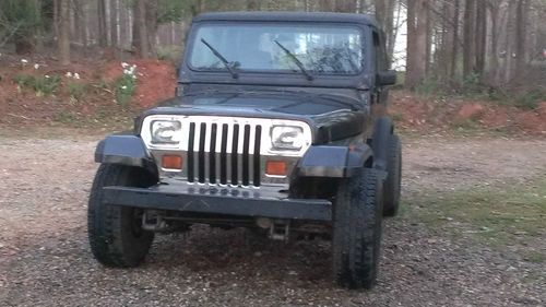 1987 jeep wrangler black.6 cylinder runs great,5 speed, plus extra very nice