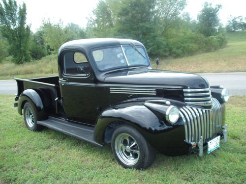 Black 1/2 ton pickup, rebuilt v8 engine,runs good