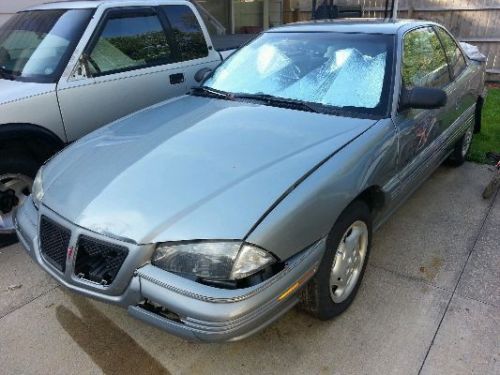 1995 silver pontiac grand am se coupe -142k miles 33mpg hwy -needs $400+ repairs