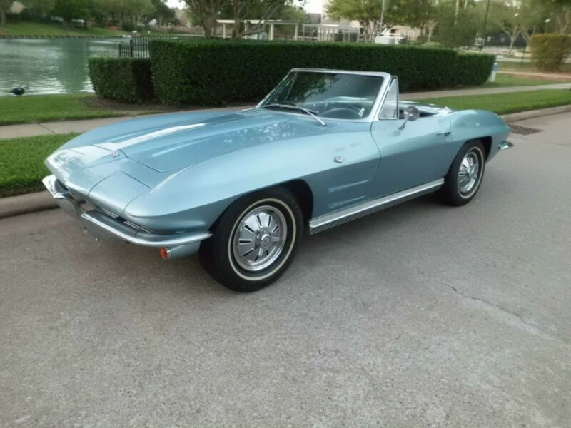 1964 chevrolet corvette black leather seats- dark blue carpet