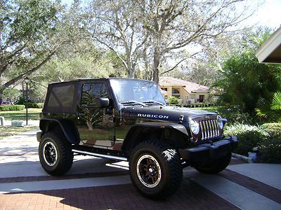 2008 jeep wrangle rubicon  4 in lift custom wheels and tires factory navigation