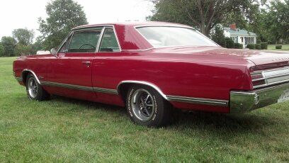 1965 oldsmobile cutlass f85 red