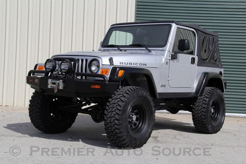 Rubicon,6 spd manual,6" fabtech long arm lift,arb bumper,winch,only 18,000 miles