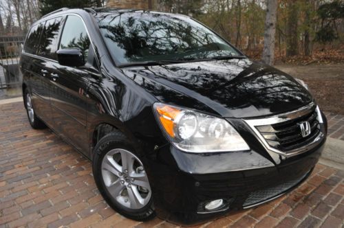 2009 honda odyssey touring edition.no reserve.leather/ navi/dvd/salvage/rebuilt