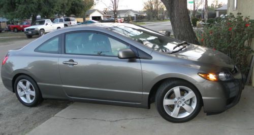 2006 honda civic ex coupe 1.8 efi 5 spd. 65,105 mi. 1 owner turbo charged! nice!