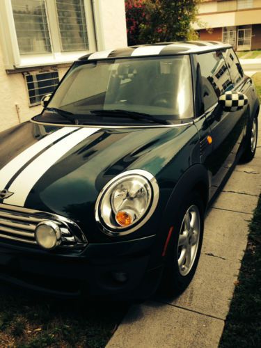 Excellent condition, hunter-green mini with sports stripes. leather interior.