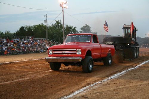 1967 chevrolet k-20 hugger orange pulling truck