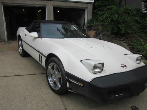 87 convertible corvette std, white, runs great, has been wrecked damaged door