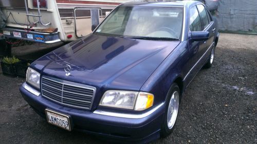 Dark blue exterior with tan leather interior