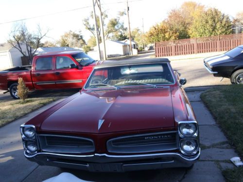 Antique/ red w/black rag top/1967 pontiac lemans convertibale