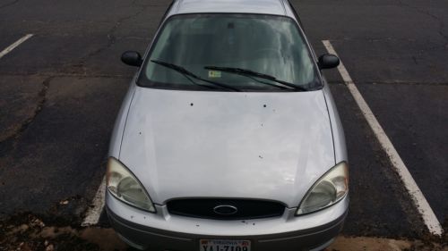 2005 silver ford taurus - runs great  low mileage for 2005 - needs a little work