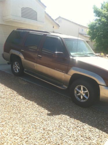 2000 burgundy/silver cadillac escalade