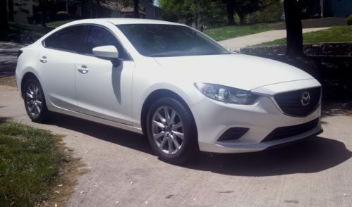 Sedan, manual, 6 speed, white, beige interior, 38 hwy mpg