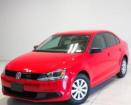 We finance !! red sporty vw jetta s 5 sp man. trans.