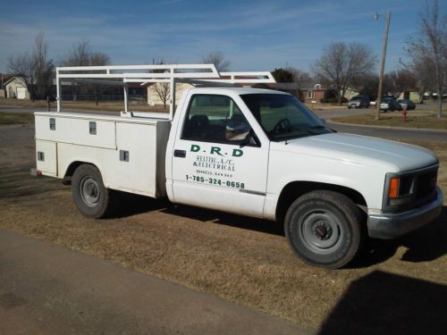Gmc 2500 work truck with utility bed and ladder rack
