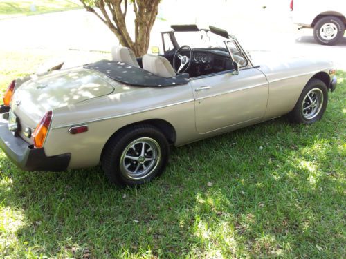 Gold british sports car convertible