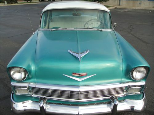 Own a restored 1956 chevy 150/210 4 door.