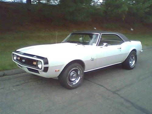 1968 camaro ss  white with black vinyl top ,pearl parchment deluxe interior