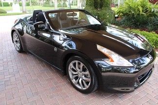 2011 nissan 370z 14k miles, fully loaded, one owner, clean carfax, we finance