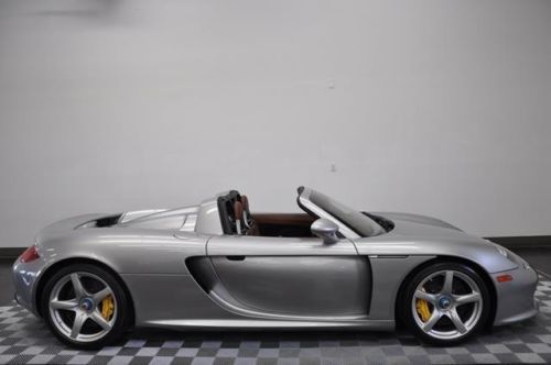 2005  carrera gt gt silver with ascot brown and blk leather interior 1470 miles.