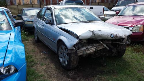 2000 bmw 323i, silver w/ black leather int. "newly crashed"