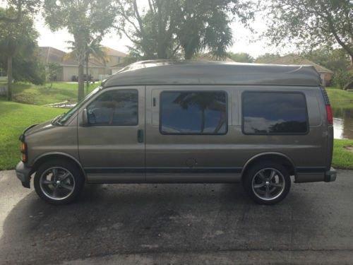 Gmc savana hi-top custom conversion van by trail master coach