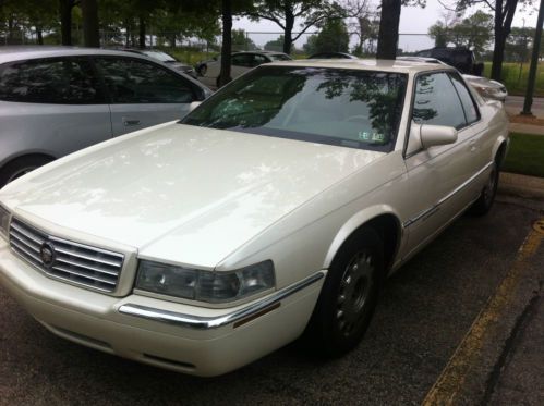 Off white/cream 1996 cadillac eldorado.