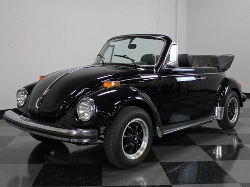 Triple black convertible, cold a/c, has a boot cover, very clean, perfect beetle