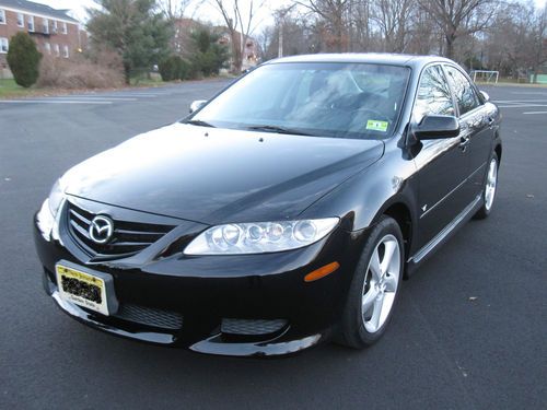 Black 4-door sport sedan in good condition with 85,000 miles