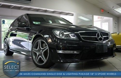 1 owner c63 comand nav lighting pkg keyless go only 5k miles black on black!!