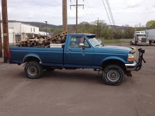 Blue f350 with snow plow, 65,000 miles, helper springs in rear, no rust